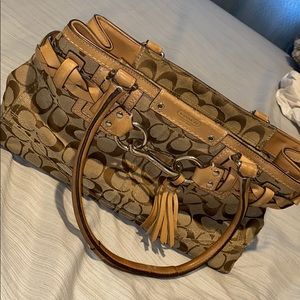 Brown Coach Handheld.